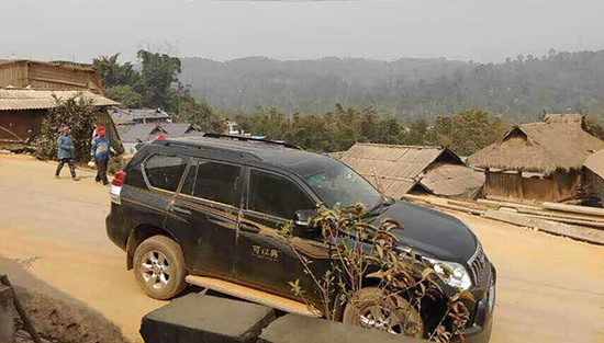 A dust-covered vehicle after crossing the mountains